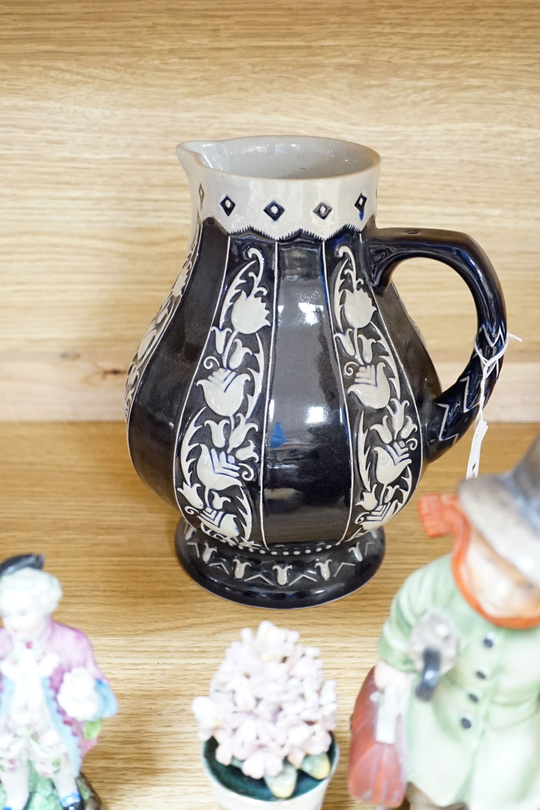 Mixed ceramics; a Madonna and child group, a jug, a pair of Sitzendorf miniature flower encrusted vases, nine small German style figures, etc. (18)